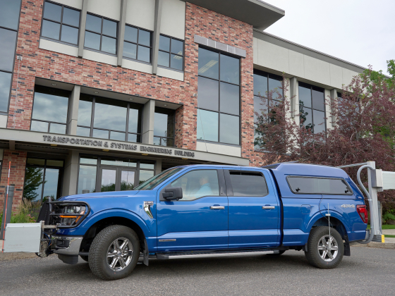 A large blue truck in front of a building | MSU photo by Colter Peterson