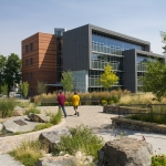 Photo of people walking past the College of Business building