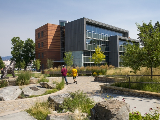Photo of people walking past the College of Business building | 