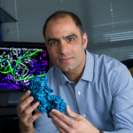 Blake Wiedenheft holding a model of a molecular structure