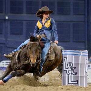 A woman on a horse competing in barrel racing