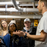 students listen to a presentation