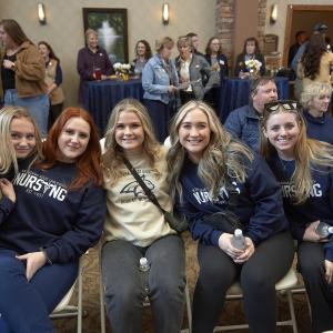 A group of people wearing Montana State University logo clothing