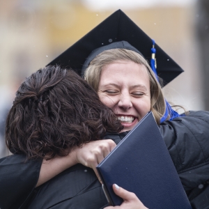 Mother and daughter hug in excitement after the fall 2019 commencement ceremony. | 