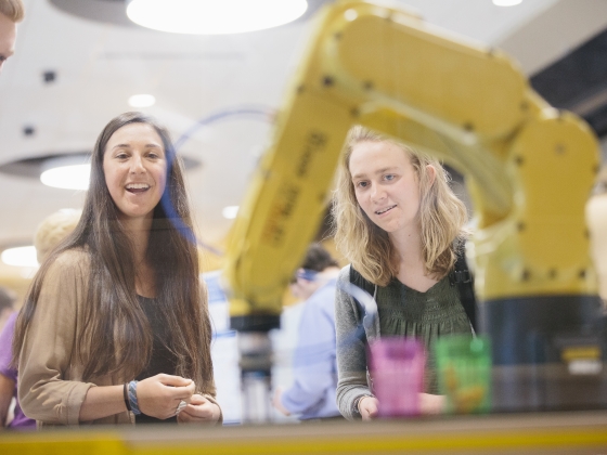 Students with industrial robot | 