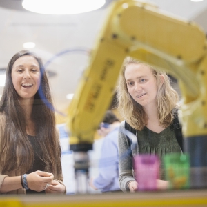 Students with industrial robot