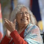 Henrietta Mann clapping and smiling