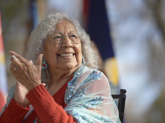 Henrietta Mann clapping and smiling | MSU photo by Kelly Gorham