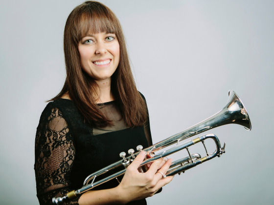 Sarah Stoneback posing with a trumpet. | MSU file photo by Adrian Sanchez-Gonzalez