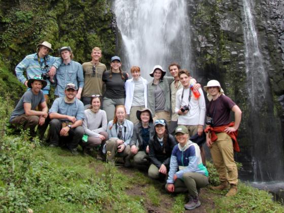group of msu students pose in front of African waterfall | 