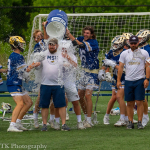 Lacrosse players douse their coach with a container of Gatorade