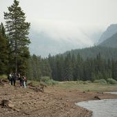 Students walking along a lakeside