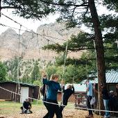 Students waling along a rope course