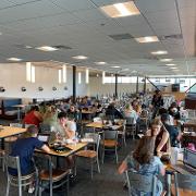 Students gathered and eating breakfast together