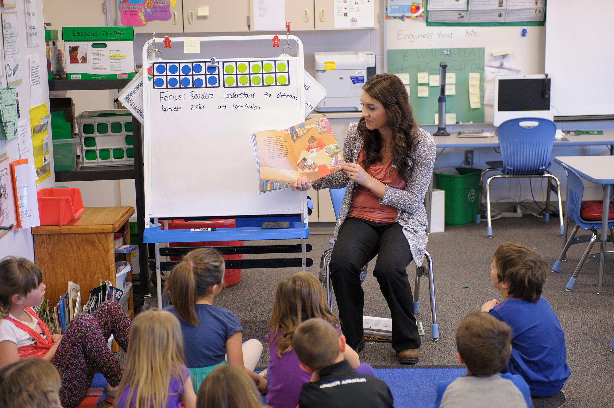 A picture of k12 aged children being read to