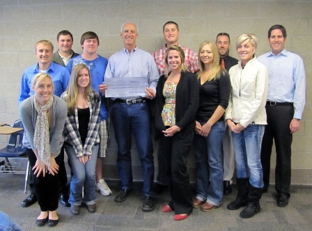 Students present a check to a person from the Heart of the Valley Animal Shelter