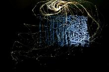 Sculpture of fiber optic cables and abstract video projection