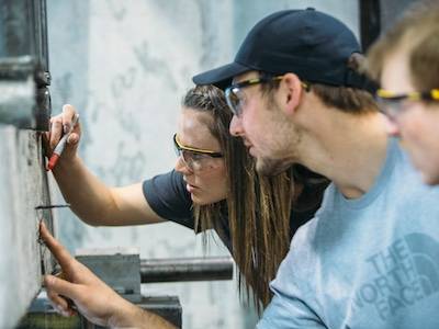 students point to concrete beam being broken