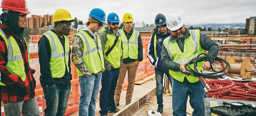 MSU civil engineering students tour the construction site of the new student dorm on campus with associate professor Michael Berry.