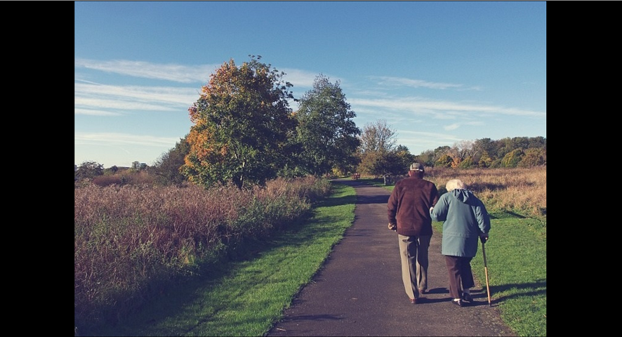 Couple walking along path