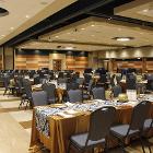 Image of long table with round tables in background.