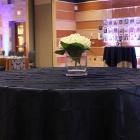 Image of flowers on table with black tablecloth.