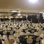 High angle image of decorated round tables with lights full.