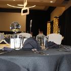 Low angle image of decorated table with mirror ball as center piece.