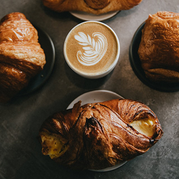 picture of a cappuccino and a croissant