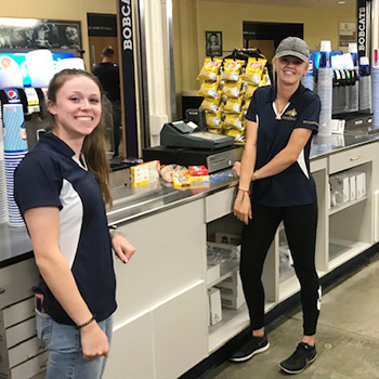 two girls working at the concession stands