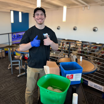 Student Custodian giving a thumbs up