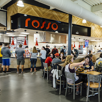 students waiting in line at the rosso pasta station in rendezvous dining pavilion