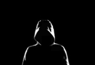 Dark Hoodie Picture of someone with a hoodie covering their face