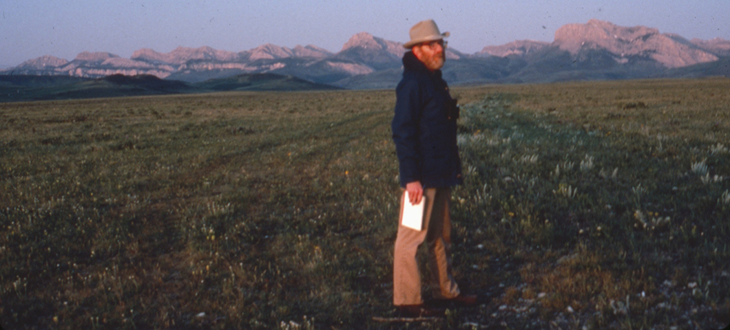 Ivan Doig standing profile in front of the Rocky Mountain front
