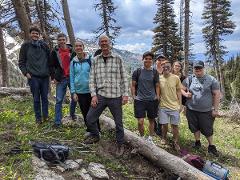 group photo while in a thin parcel of forest