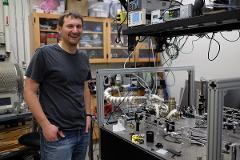 student amongst lab equipment