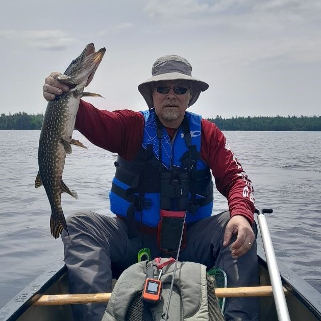 Photo of Kevin Johnson holding a fish