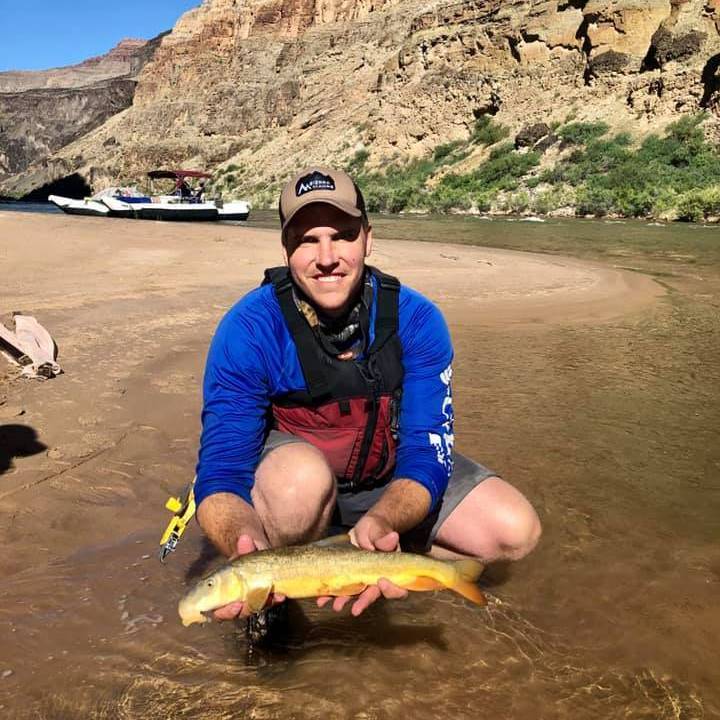 Photo of Nate Clifton holding a fish