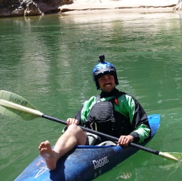 Photo of Sam Steel in a Kayak on the Colorado River