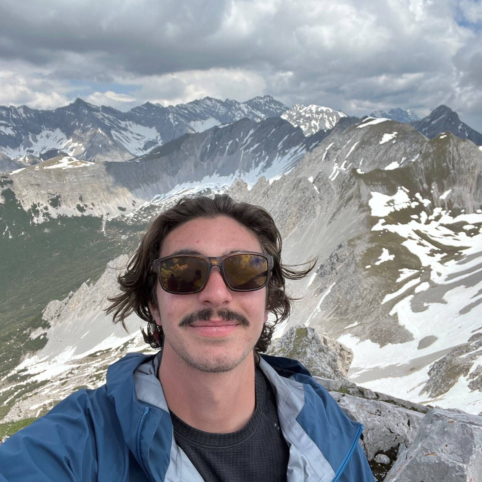 Photo of Anthony Bruno with mountains in the background