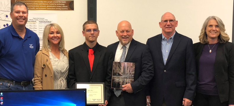 MCEE and Bancorp representatives presented Ryan Ness (Laurel High School) an award for finishing in the top five out of 300 teams in the Stock Market Game