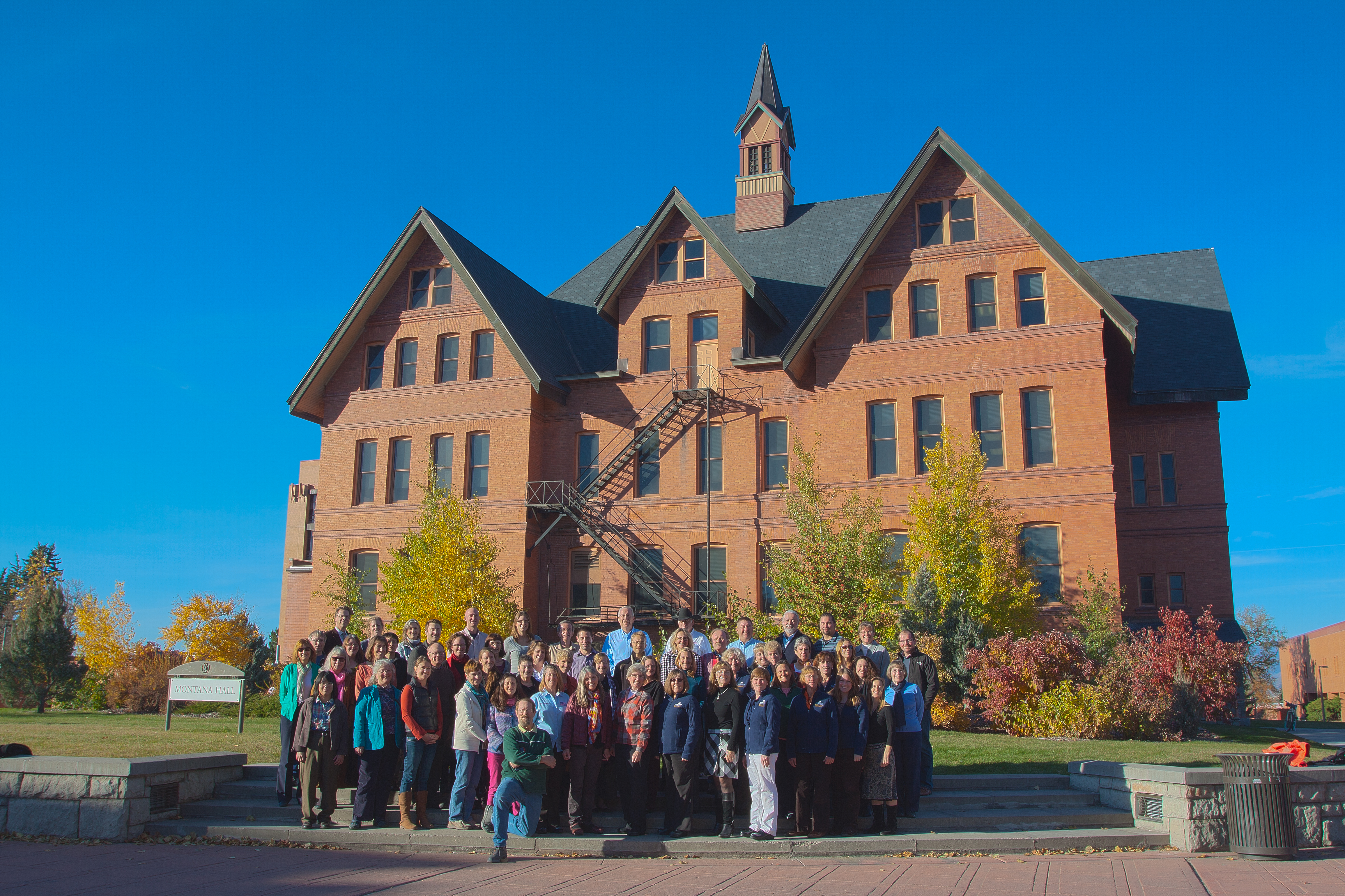 Faculty standing in front of Montana Hall