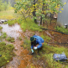 Student sampling mine influenced water for microbial analysis to investigate potential bioremediation. (E. Lauchner lab, photo credit: Emily Stoick) 