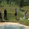 Students sampling hot springs to characterize microbes that live in extreme conditions. (B. Peyton lab, photo Extended University)