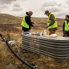 Collecting well water samples for lab analysis of baseline water chemistry of the shallow subsurface in the Kevin Dome project area.