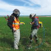 Collecting baseline CO2 soil gas flux near the proposed CO2 injection well.