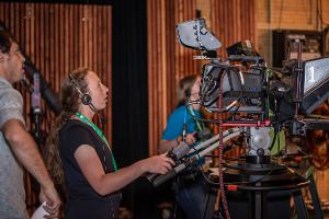 girl with large tv camera