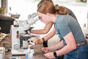 girl at a microscope