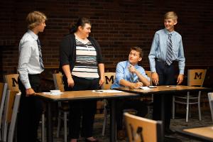 group at a table in a meeting