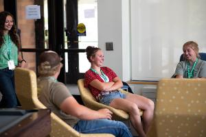 group of kids in dorm sitting in the chairs